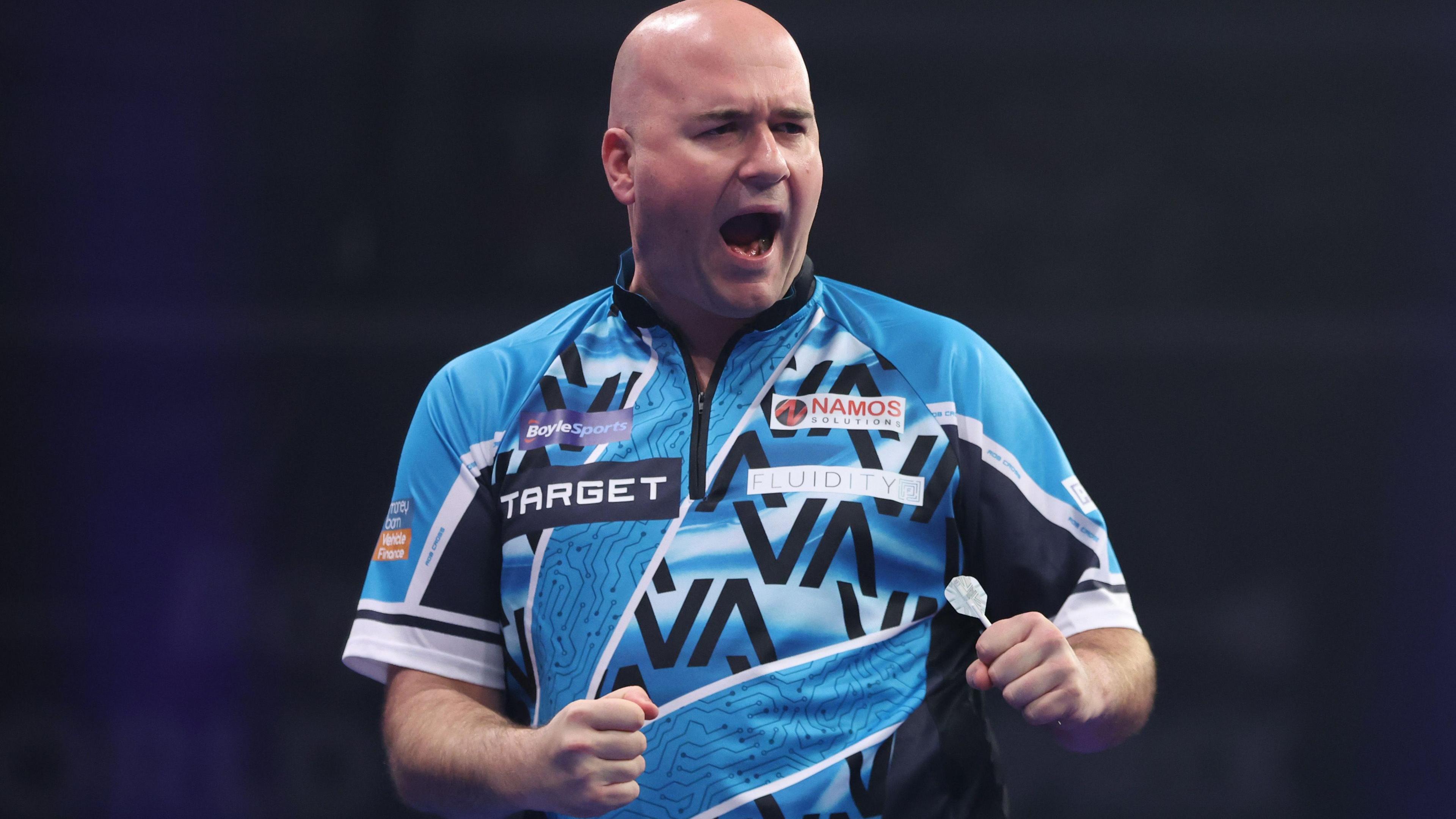 Rob Cross célèbre sa victoire contre Peter Wright