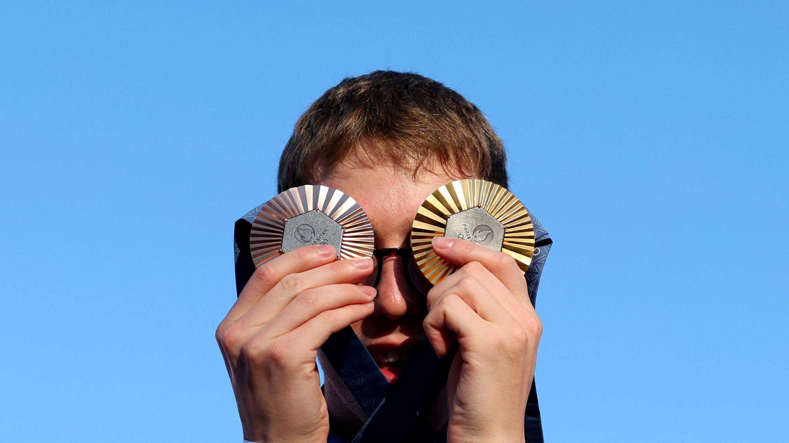 Swimmer Daniel Wiffen with his Olympic gold and bronze medals in Paris.