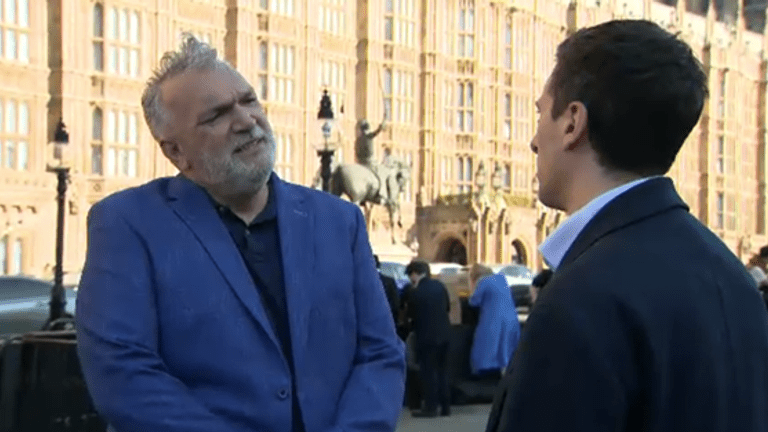Neil Ruddock speaks to Sky's Rob Harris outside parliament
