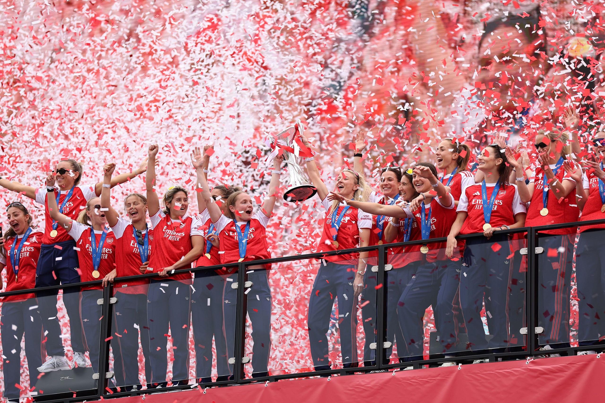 Arsenal players lift the trophy